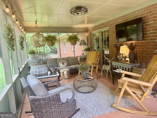 sunroom / solarium featuring an outdoor living space and a wealth of natural light