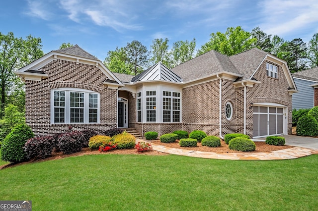 6732 Chimney Ridge Ct, Hoschton, GA 30548 - view of front of house featuring brick siding, a front lawn, concrete driveway, and roof with shingles