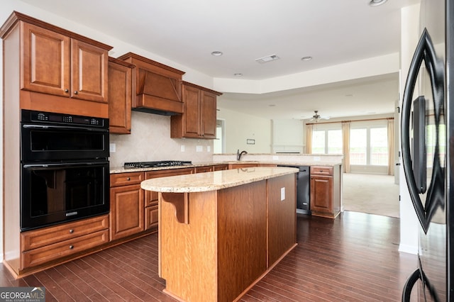6732 Chimney Ridge Ct, Hoschton, GA 30548 - kitchen featuring fridge, a peninsula, dishwasher, dark wood-type flooring, and a kitchen island