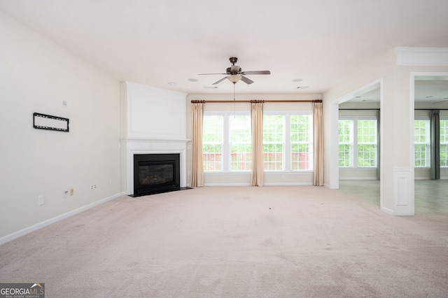 6732 Chimney Ridge Ct, Hoschton, GA 30548 - unfurnished living room featuring ceiling fan, light colored carpet, and a fireplace with flush hearth