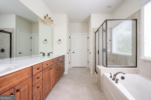 6732 Chimney Ridge Ct, Hoschton, GA 30548 - bathroom featuring a stall shower, double vanity, and a garden tub