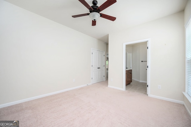 6732 Chimney Ridge Ct, Hoschton, GA 30548 - unfurnished bedroom featuring light carpet, ensuite bathroom, multiple windows, and ceiling fan