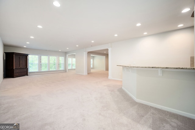 6732 Chimney Ridge Ct, Hoschton, GA 30548 - unfurnished living room with light carpet and recessed lighting