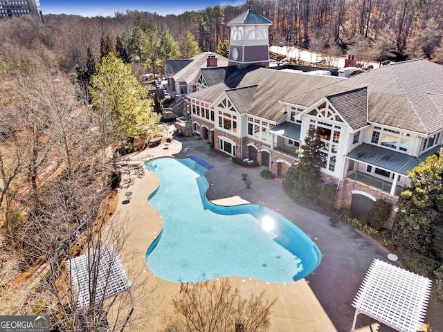 6732 Chimney Ridge Ct, Hoschton, GA 30548 - swimming pool featuring a patio and a view of trees