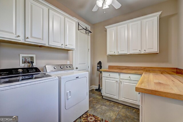 washroom featuring cabinet space, a ceiling fan, baseboards, and washing machine and clothes dryer