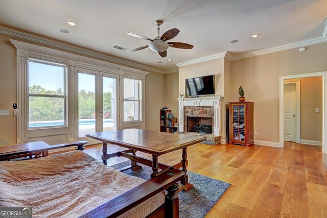 wooden terrace featuring a swimming pool, a ceiling fan, and a forest view
