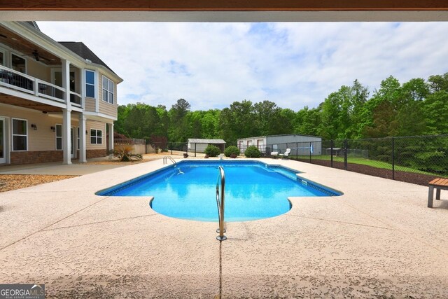 view of pool featuring a fenced backyard, a fenced in pool, and a patio area