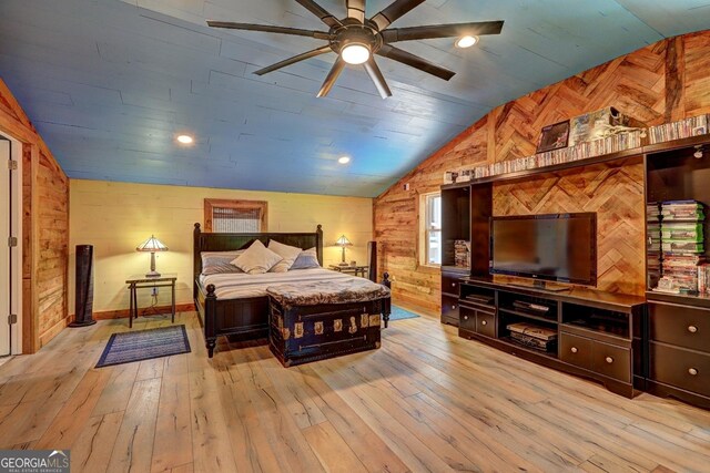 bedroom featuring recessed lighting, wood walls, light wood-style flooring, and vaulted ceiling