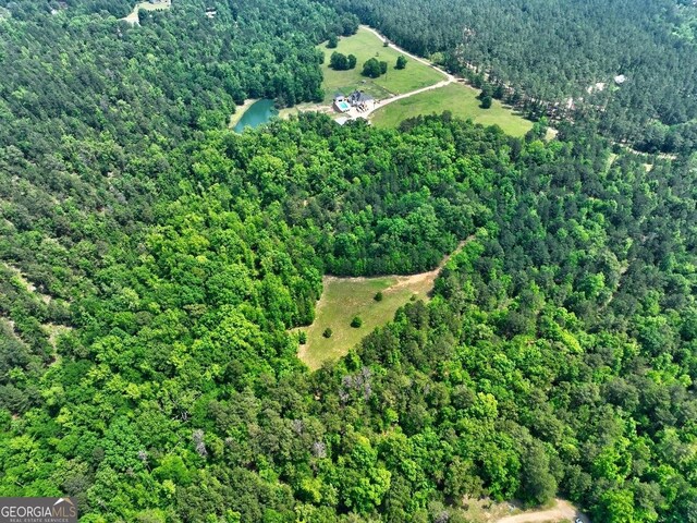 bird's eye view featuring a forest view