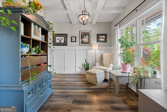 485 Lloyd St, Monticello, GA 31064 - sitting room with coffered ceiling, a chandelier, beam ceiling, a wainscoted wall, and dark wood-style floors