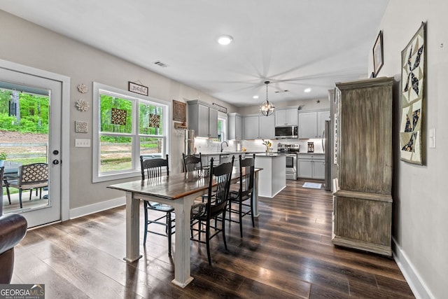 485 Lloyd St, Monticello, GA 31064 - dining space with dark wood-type flooring, recessed lighting, and baseboards