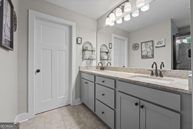 485 Lloyd St, Monticello, GA 31064 - bathroom featuring double vanity, baseboards, tile patterned floors, and tiled shower
