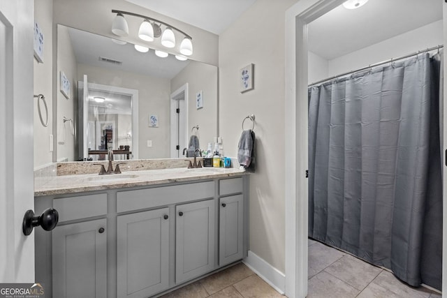 485 Lloyd St, Monticello, GA 31064 - bathroom featuring vanity, tile patterned floors, and baseboards