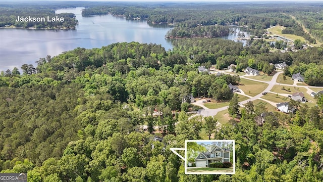 485 Lloyd St, Monticello, GA 31064 - aerial view of property and surrounding area with a heavily wooded area, a nearby body of water, and property boundaries highlighted