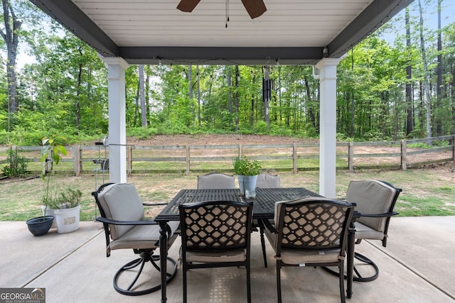 485 Lloyd St, Monticello, GA 31064 - fenced backyard with outdoor dining space, a ceiling fan, and a patio area