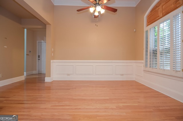 unfurnished room with ceiling fan, ornamental molding, and light wood-type flooring