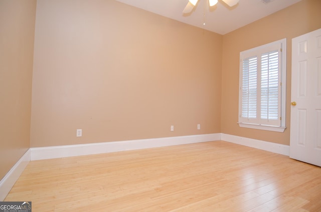 unfurnished room featuring baseboards, ceiling fan, and light wood-style flooring