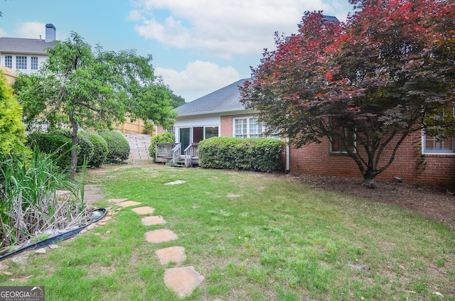 view of yard with a deck