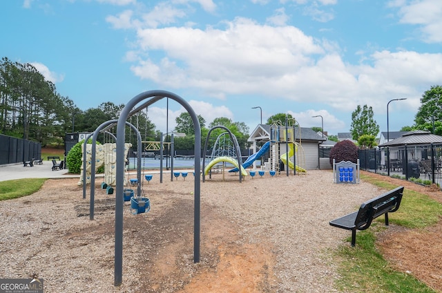 community jungle gym featuring fence