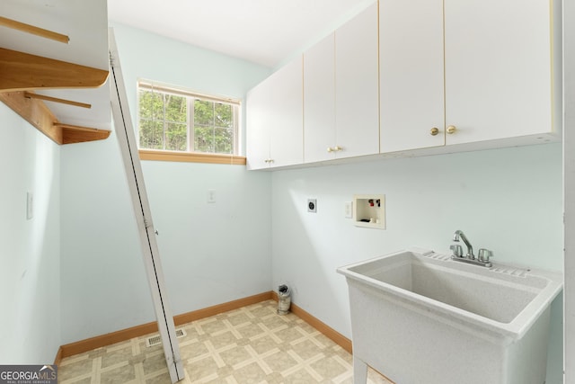 laundry area featuring cabinet space, washer hookup, a sink, electric dryer hookup, and light floors