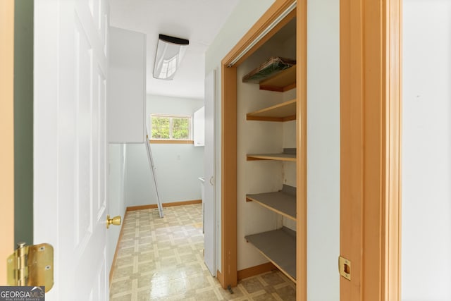 bathroom with tile patterned floors and baseboards