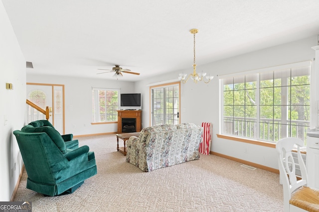 living area with baseboards, carpet floors, and visible vents