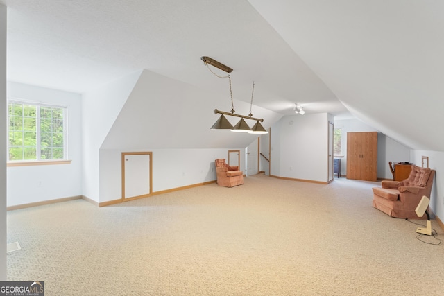 bonus room with baseboards, carpet, and vaulted ceiling