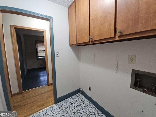 1517 Colony E Cir, Stone Mountain, GA 30083 - washroom with baseboards, washer hookup, electric dryer hookup, and cabinet space