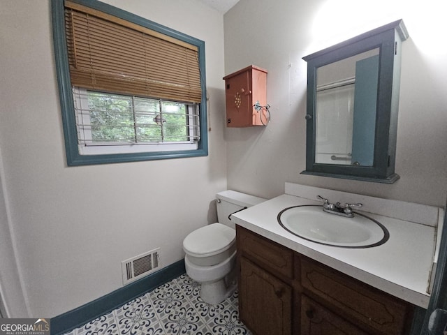 1517 Colony E Cir, Stone Mountain, GA 30083 - bathroom with vanity, baseboards, toilet, and visible vents