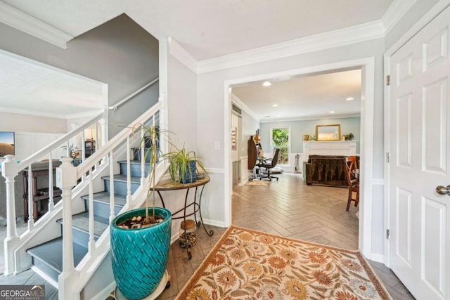 foyer featuring stairs, recessed lighting, baseboards, and ornamental molding