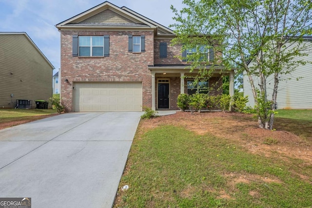 view of front facade with brick siding, driveway, a front yard, and a garage
