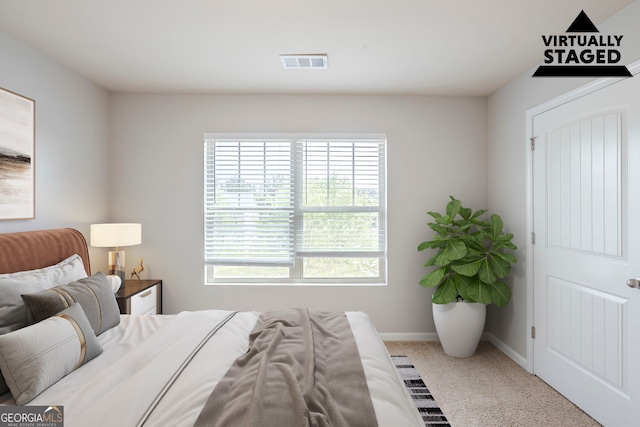 1003 Eldon Ln, Fairburn, GA 30213 - bedroom with baseboards, visible vents, and carpet floors