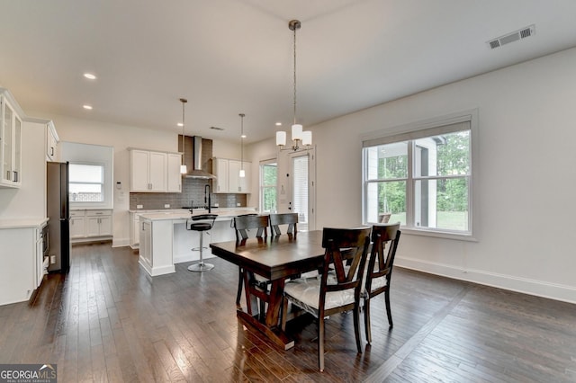 dining space featuring recessed lighting, baseboards, dark wood finished floors, and visible vents