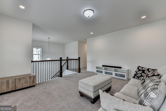 living area with carpet floors and recessed lighting