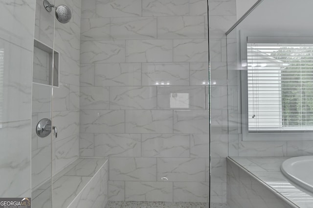 full bath with tiled shower