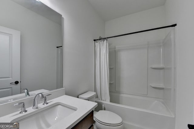 bathroom with vanity, toilet, and shower / tub combo