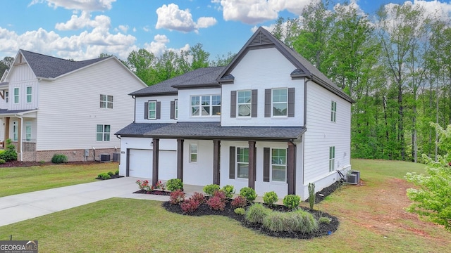 view of front of property with cooling unit, roof with shingles, an attached garage, driveway, and a porch
