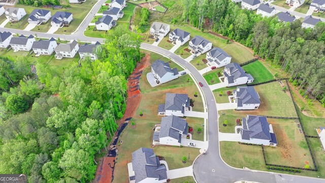 birds eye view of property with a residential view
