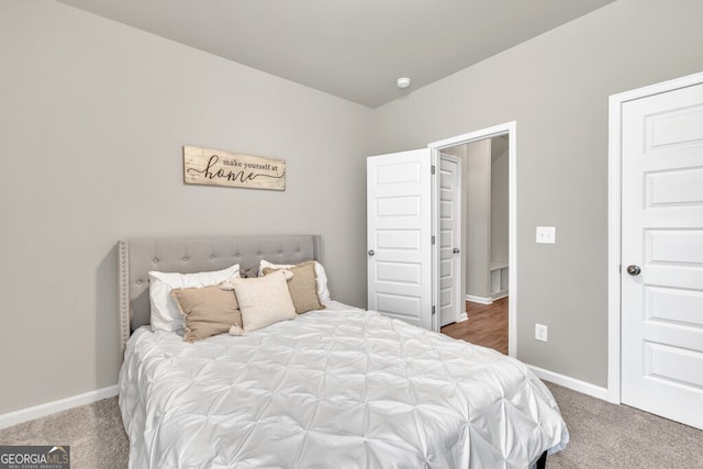 carpeted bedroom with baseboards