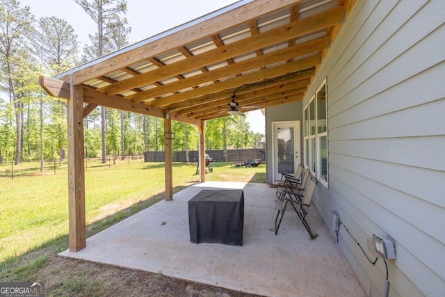 view of patio / terrace featuring fence and ceiling fan