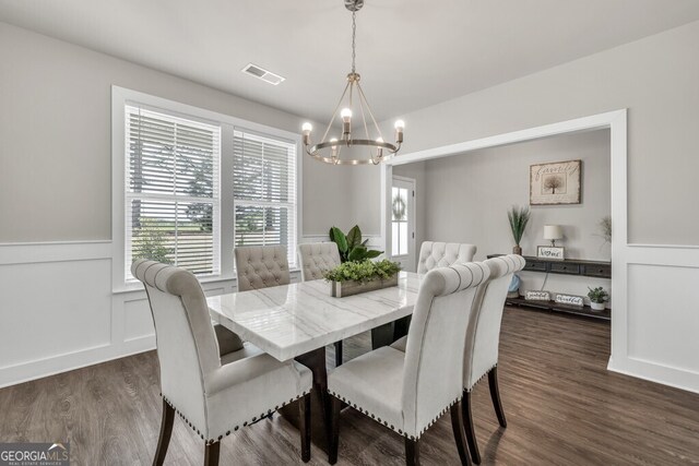 233 Jim Daws Rd, Monroe, GA 30655 - dining room featuring a chandelier, wainscoting, dark wood finished floors, and a decorative wall