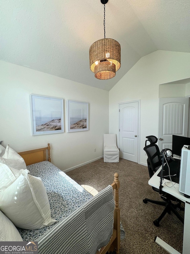 bedroom featuring lofted ceiling, carpet, a desk, baseboards, and a textured ceiling