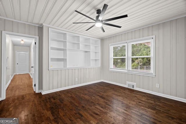 unfurnished room featuring crown molding, ceiling fan, baseboards, visible vents, and dark wood-style floors