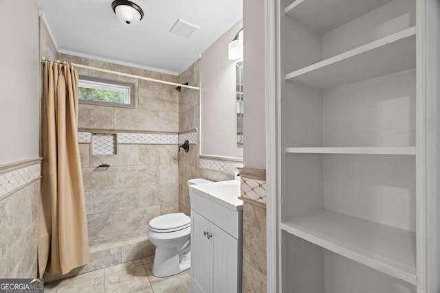 1154 Rome St, Carrollton, GA 30117 - full bath with tile walls, vanity, tiled shower, tile patterned flooring, and a wainscoted wall
