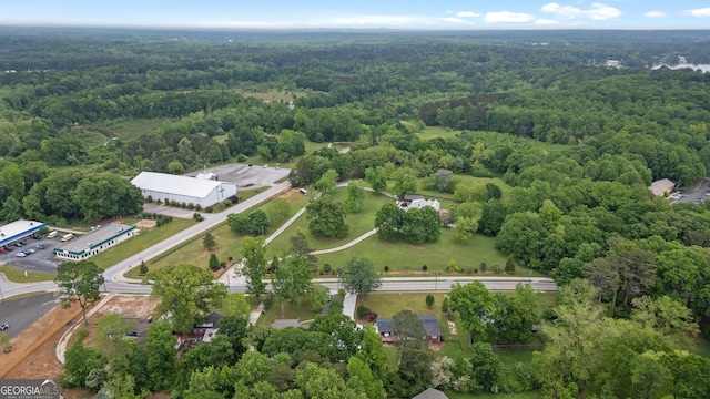 drone / aerial view featuring a view of trees
