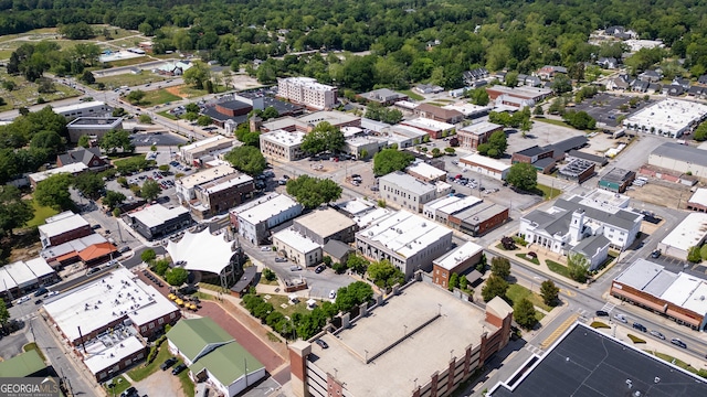 birds eye view of property with a wooded view