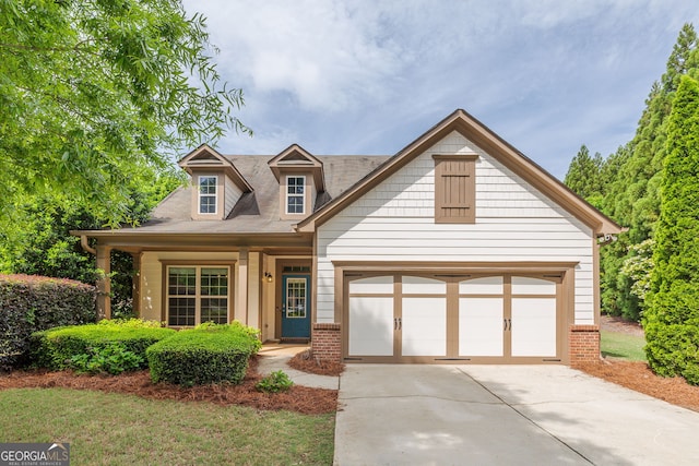 1355 Hesse Ln, Austell, GA 30106 - view of front facade with concrete driveway, brick siding, and an attached garage