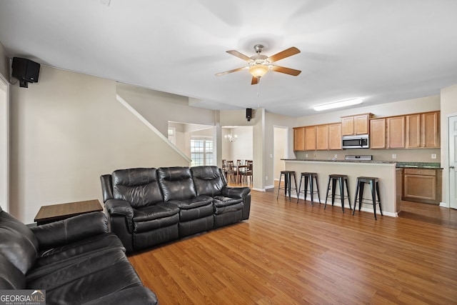 1355 Hesse Ln, Austell, GA 30106 - living area with baseboards, ceiling fan, and light wood-type flooring