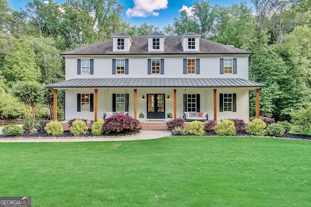 650 Jones Rd, Roswell, GA 30075 - modern inspired farmhouse with a standing seam roof, a front lawn, a porch, and french doors