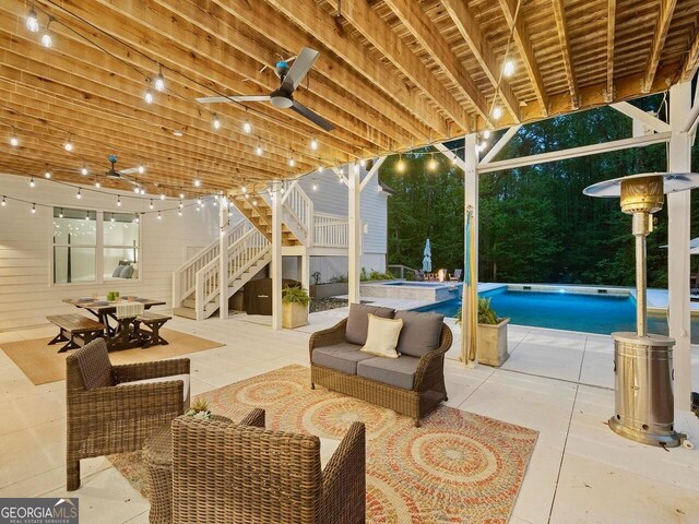 650 Jones Rd, Roswell, GA 30075 - view of patio / terrace featuring ceiling fan, a pool with connected hot tub, stairway, an outdoor hangout area, and outdoor dining space